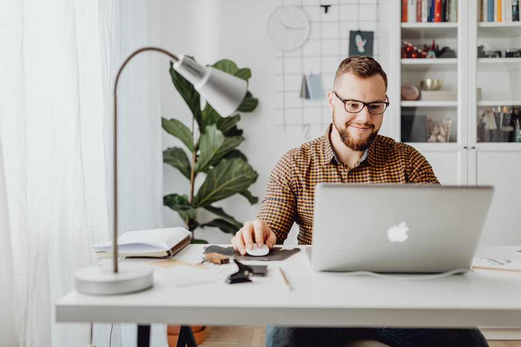 Entrepreneur shown working on his laptop